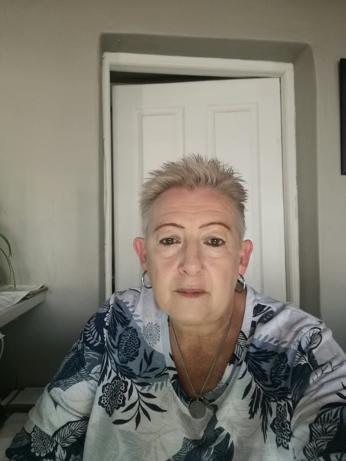 Joubert Optometrists team member in a floral blouse